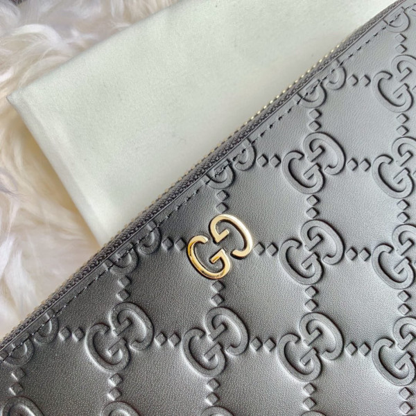G*u*i leather zip around wallet
